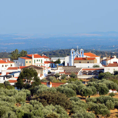 Pardais village, Vila Viçosa, Evora district, Portugal: the village of Pardais surrounded by olive orchards - at the center the church of Saint Catherine of Alexandria - Igreja Paroquial de Santa Catarina de Alexandria