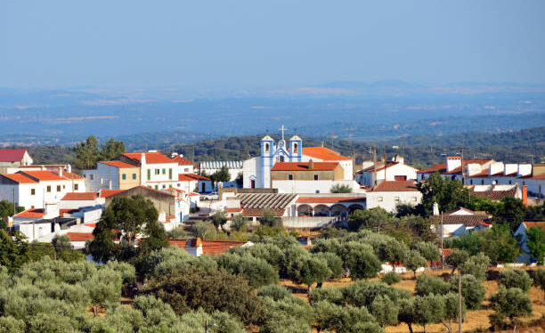 Pardais village, Vila Viçosa, Evora district, Portugal: the village of Pardais surrounded by olive orchards - at the center the church of Saint Catherine of Alexandria - Igreja Paroquial de Santa Catarina de Alexandria