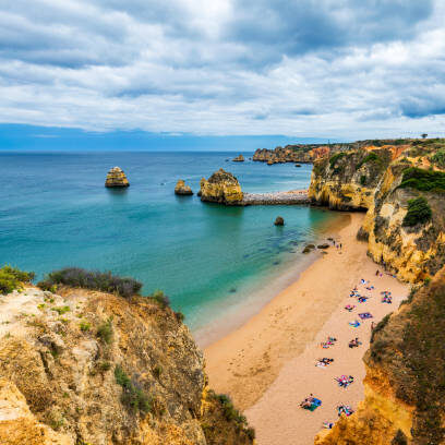 Praia Dona Ana beach with turquoise sea water and cliffs, Portugal. Beautiful Dona Ana Beach (Praia Dona Ana) in Lagos, Algarve, Portugal.